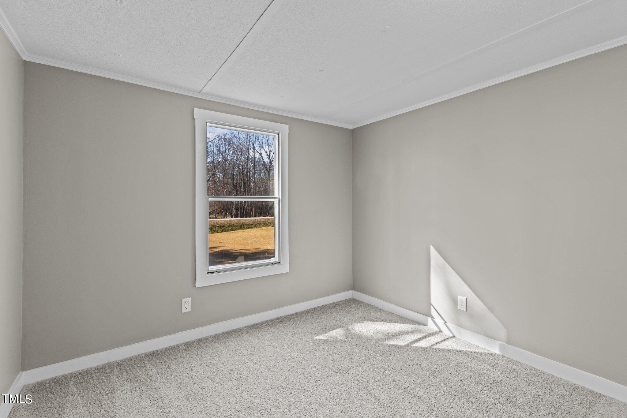 365 Rev Henderson Road Henderson, NC 27537 - Photo 18 of 48 an empty room with a window