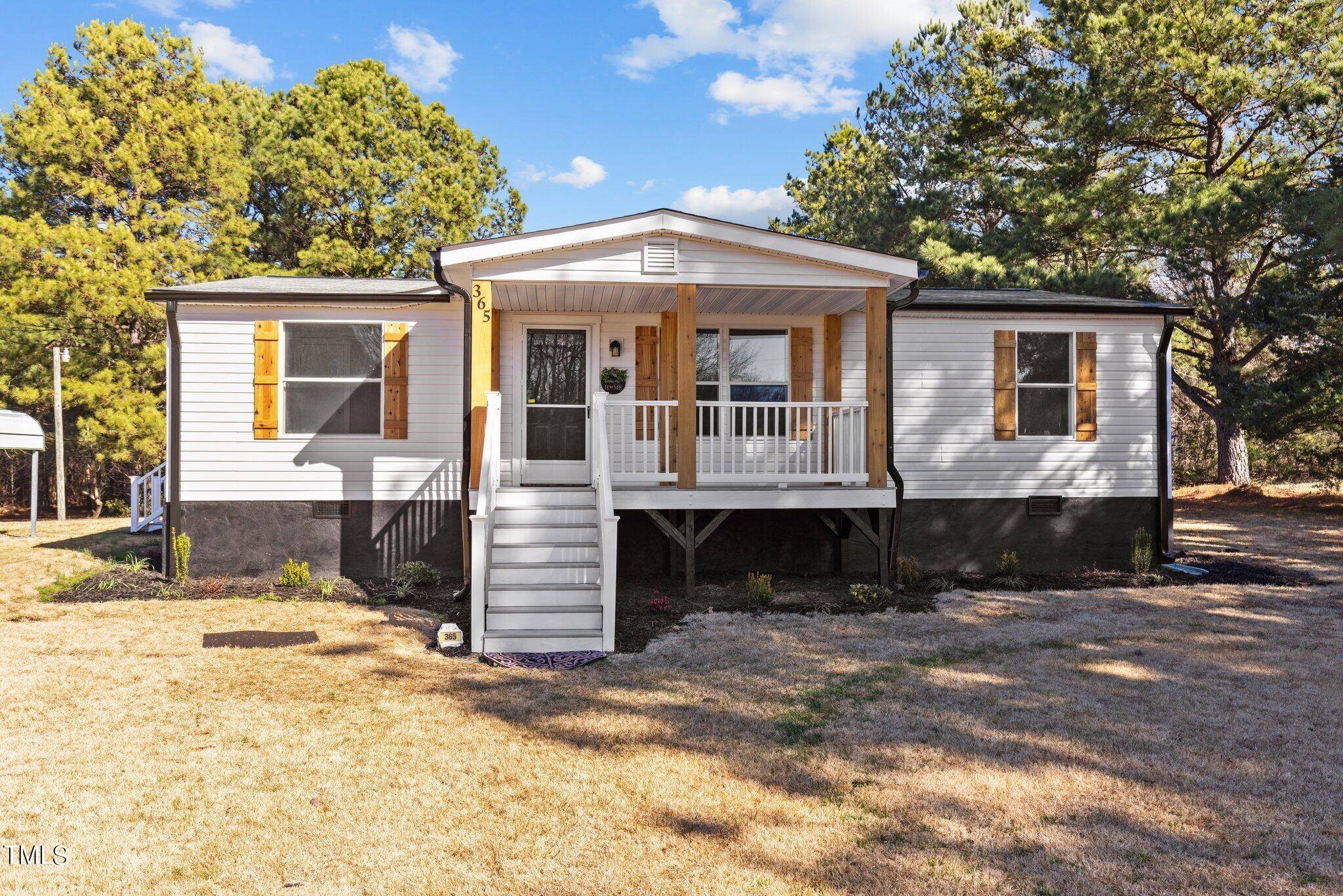 365 Rev Henderson Road Henderson, NC 27537 - Photo 2 of 48 a front view of a house with a yard