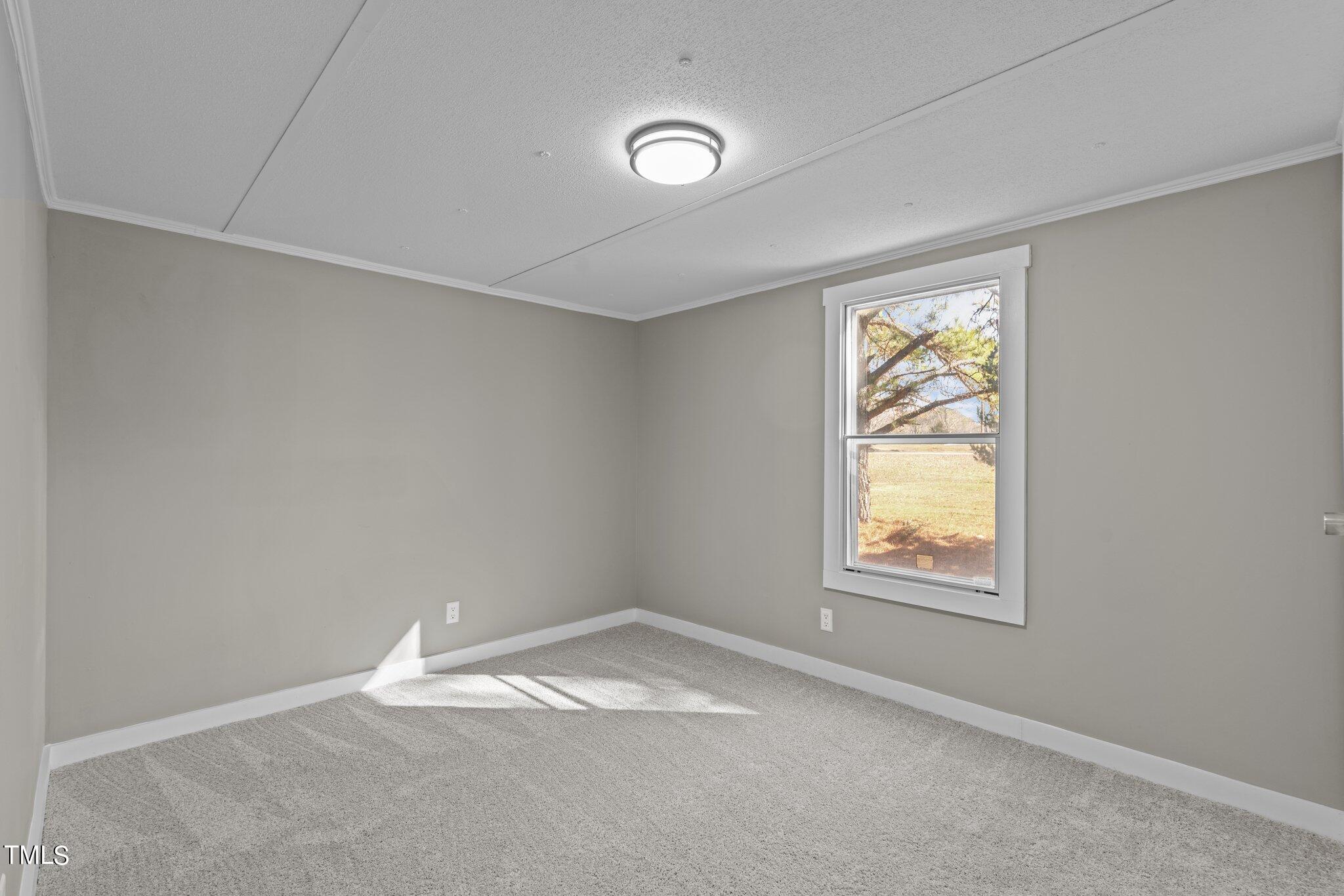 365 Rev Henderson Road Henderson, NC 27537 - Photo 22 of 48 an empty room with windows