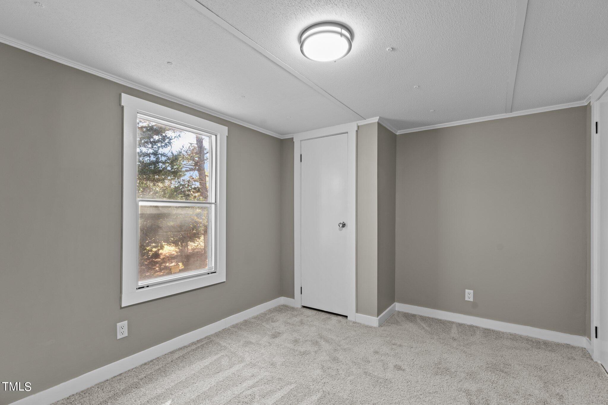 365 Rev Henderson Road Henderson, NC 27537 - Photo 23 of 48 an empty room with windows and closet