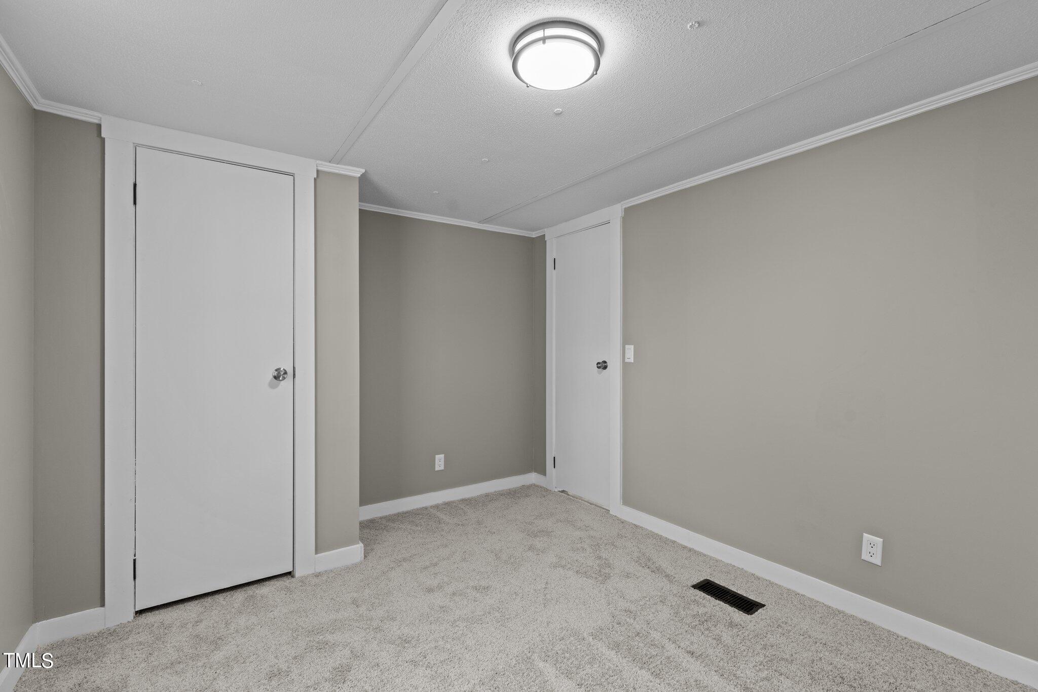 365 Rev Henderson Road Henderson, NC 27537 - Photo 24 of 48 an empty room with closet area