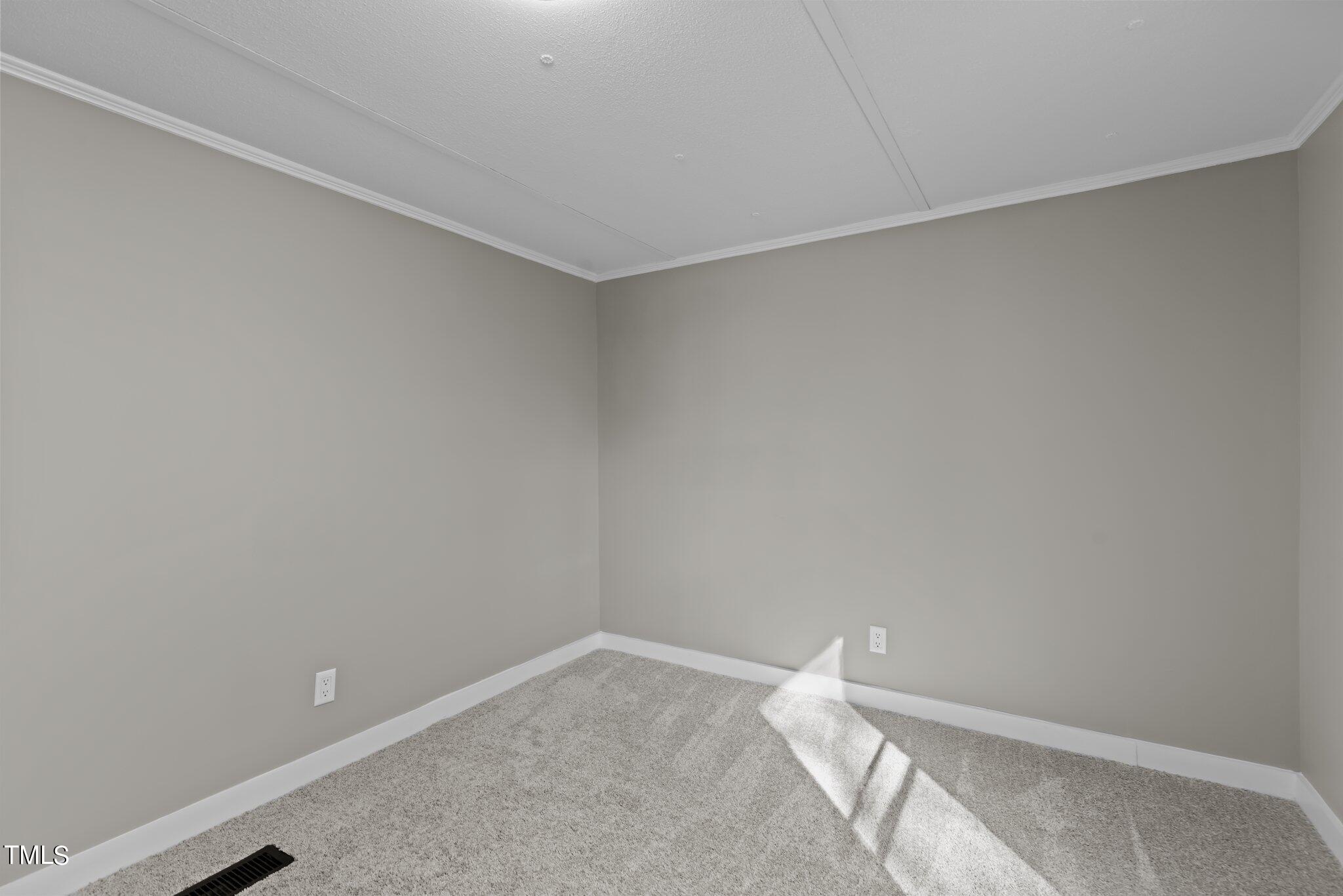 365 Rev Henderson Road Henderson, NC 27537 - Photo 25 of 48 a room with a white wall and a window