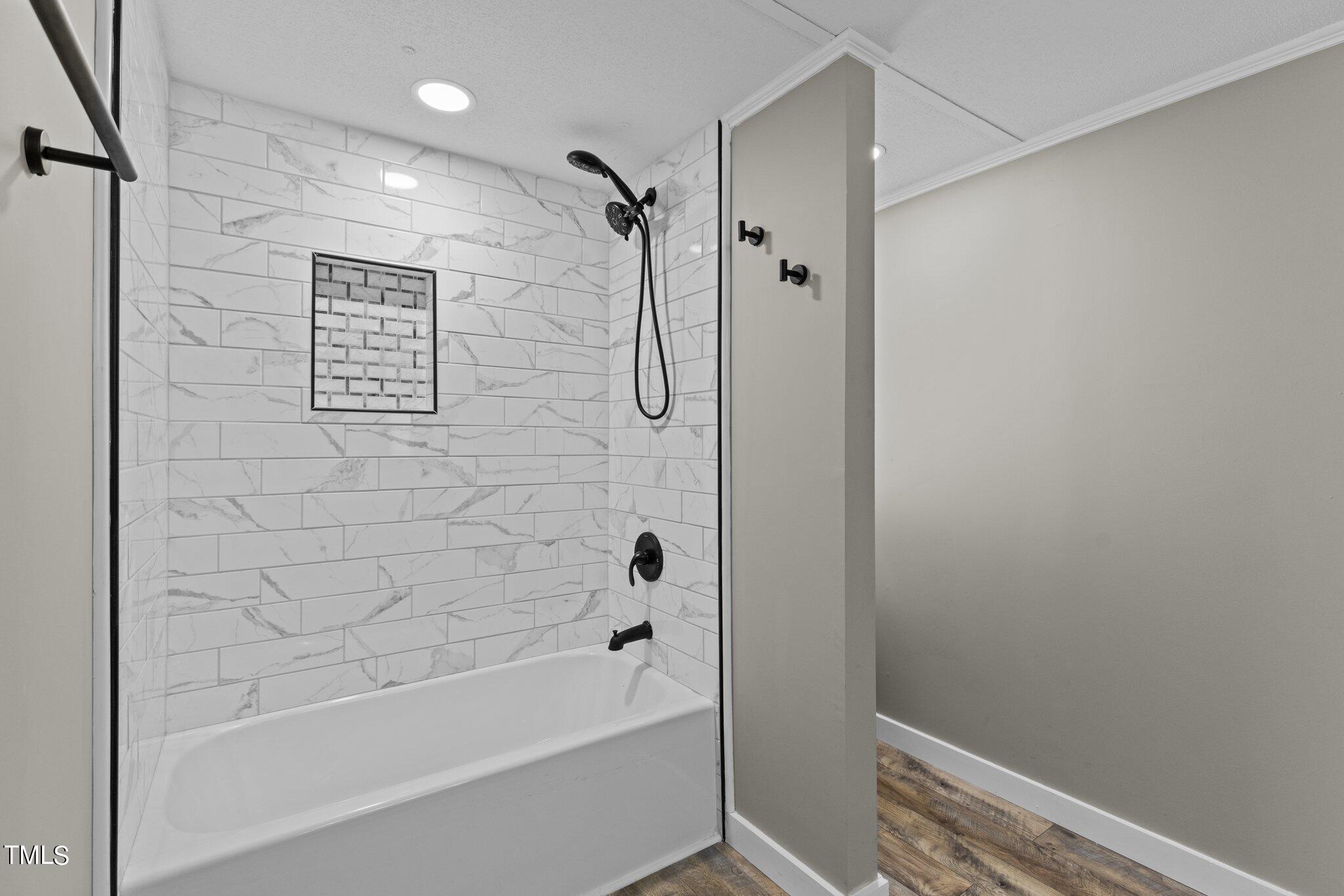 365 Rev Henderson Road Henderson, NC 27537 - Photo 30 of 48 a bathroom with a shower and a bath tub