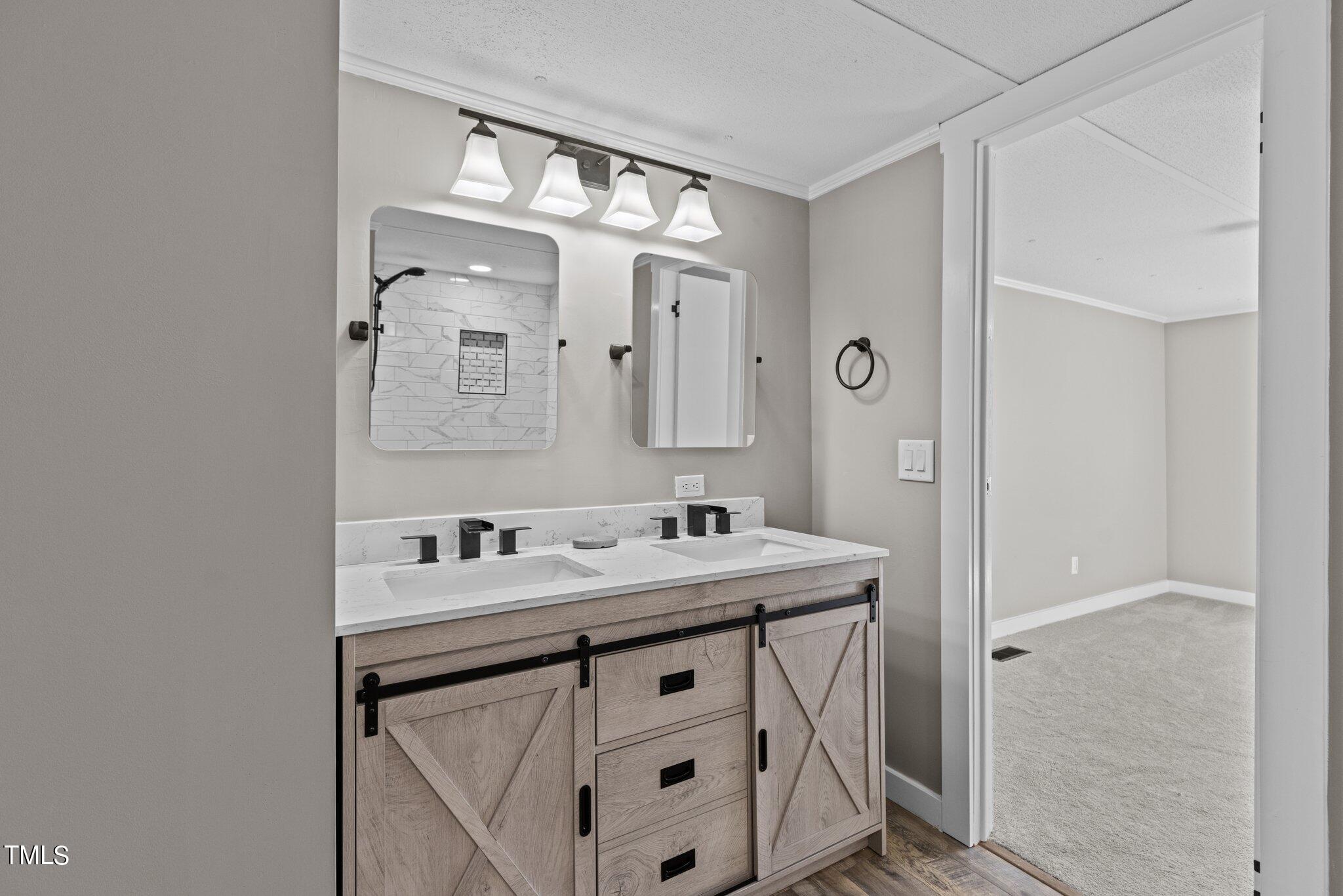 365 Rev Henderson Road Henderson, NC 27537 - Photo 31 of 48 a bathroom with a sink vanity and a mirror