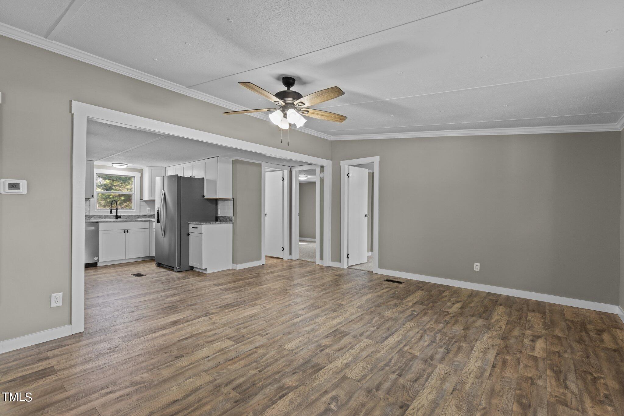 365 Rev Henderson Road Henderson, NC 27537 - Photo 4 of 48 a view of an empty room with a kitchen