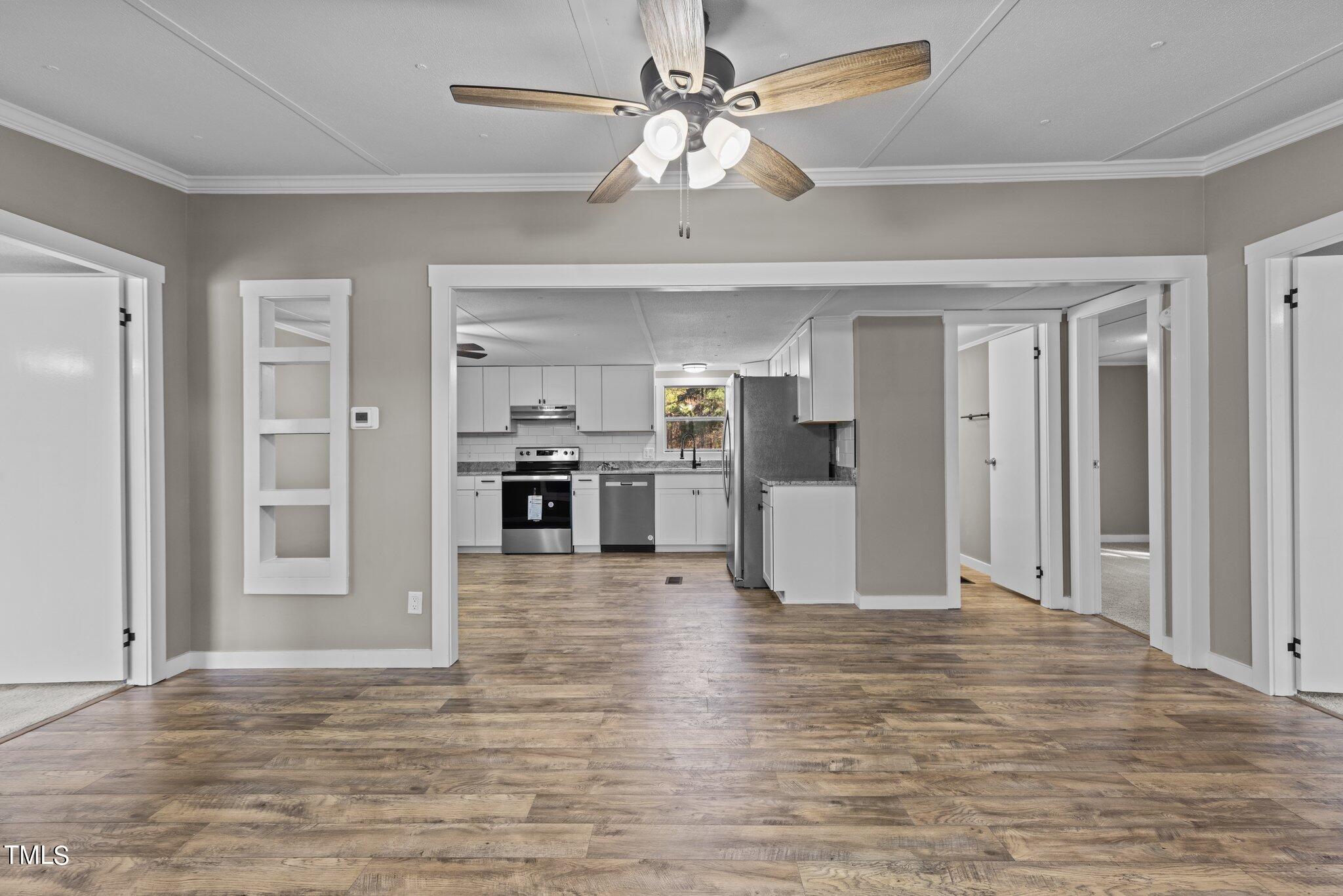 365 Rev Henderson Road Henderson, NC 27537 - Photo 9 of 48 a view of a kitchen with a stove cabinets and wooden floor