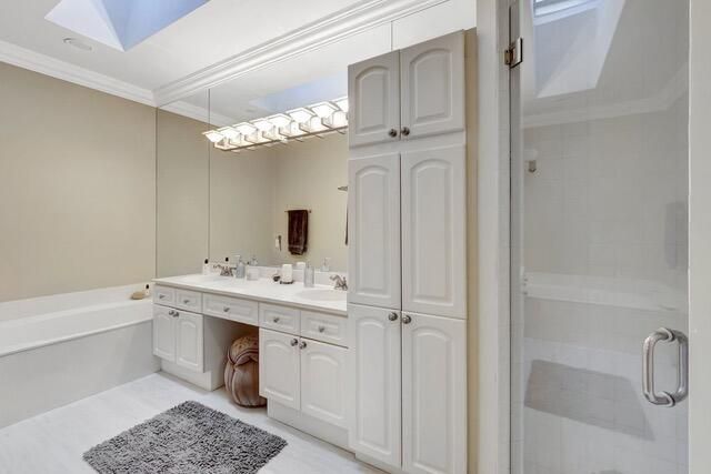 a bathroom with a bathtub a sink and a mirror