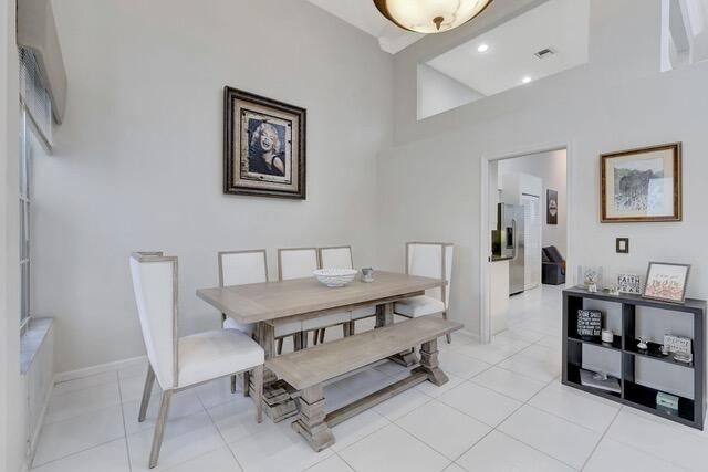 a living room with furniture a window and a lamp