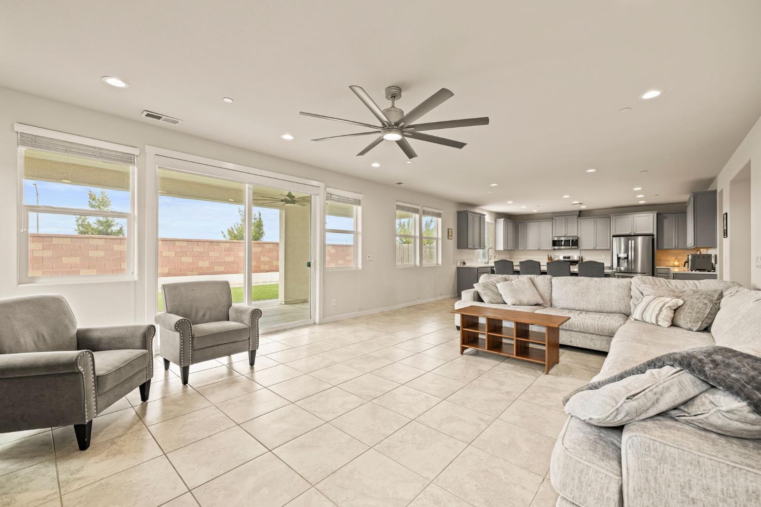 a living room with furniture and a large window with outer view