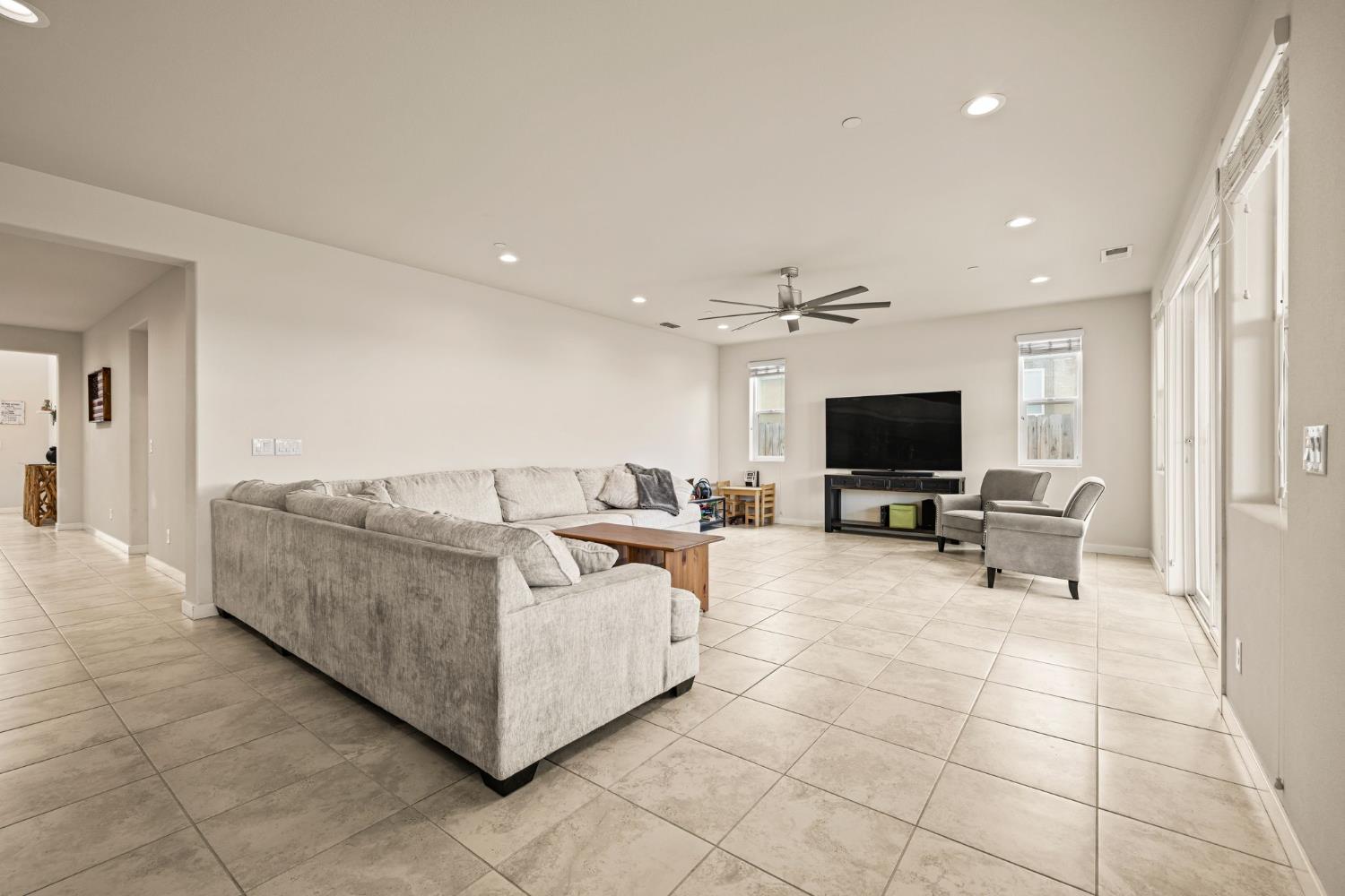4040 Aura Way Rancho Cordova, CA 95742 - Photo 11 of 49 a living room with furniture and a flat screen tv