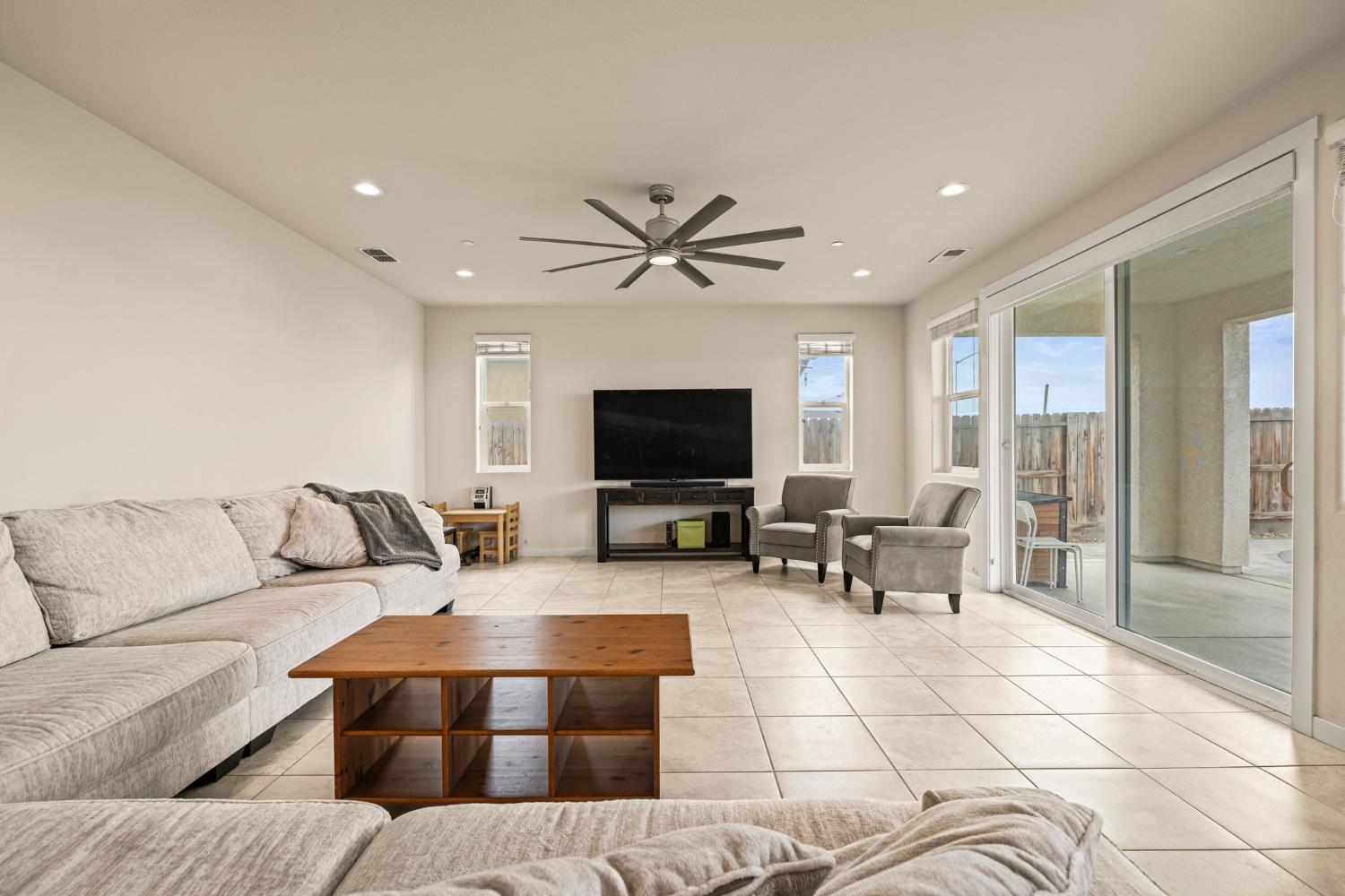 4040 Aura Way Rancho Cordova, CA 95742 - Photo 12 of 49 a living room with furniture and a flat screen tv