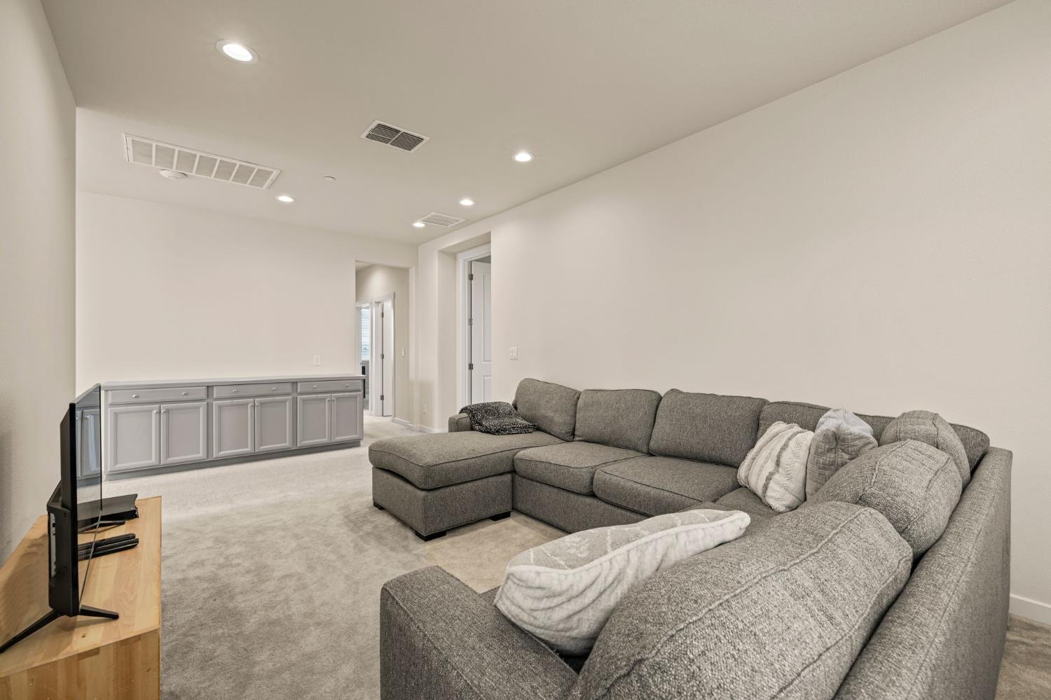 4040 Aura Way Rancho Cordova, CA 95742 - Photo 21 of 49 a living room with furniture and a couch