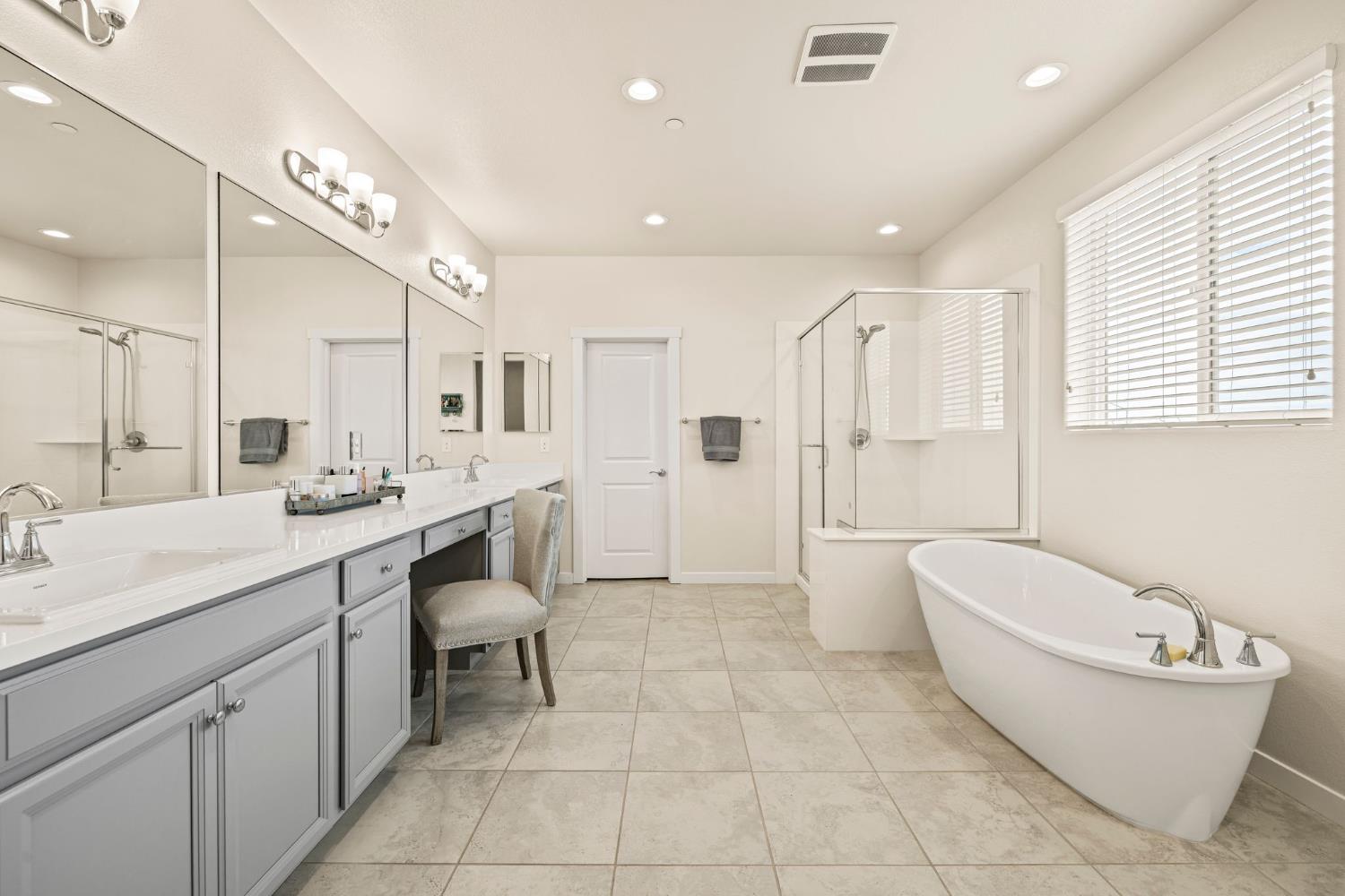 4040 Aura Way Rancho Cordova, CA 95742 - Photo 28 of 49 a bathroom with a bathtub shower sink and mirror