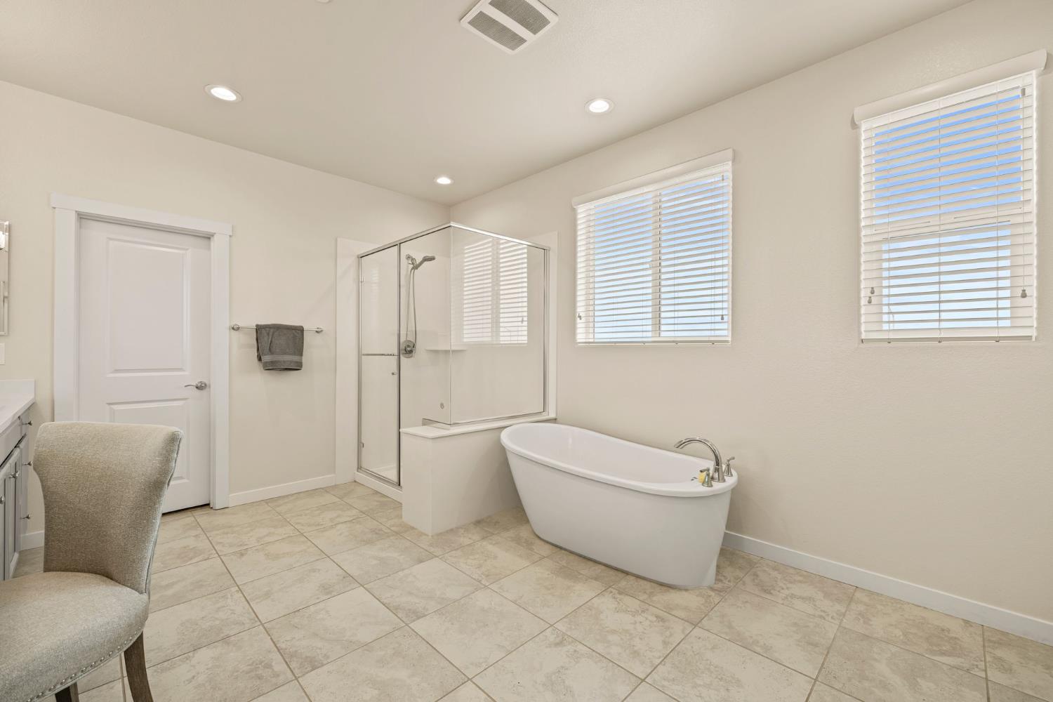 4040 Aura Way Rancho Cordova, CA 95742 - Photo 29 of 49 a spacious bathroom with a bathtub and shower