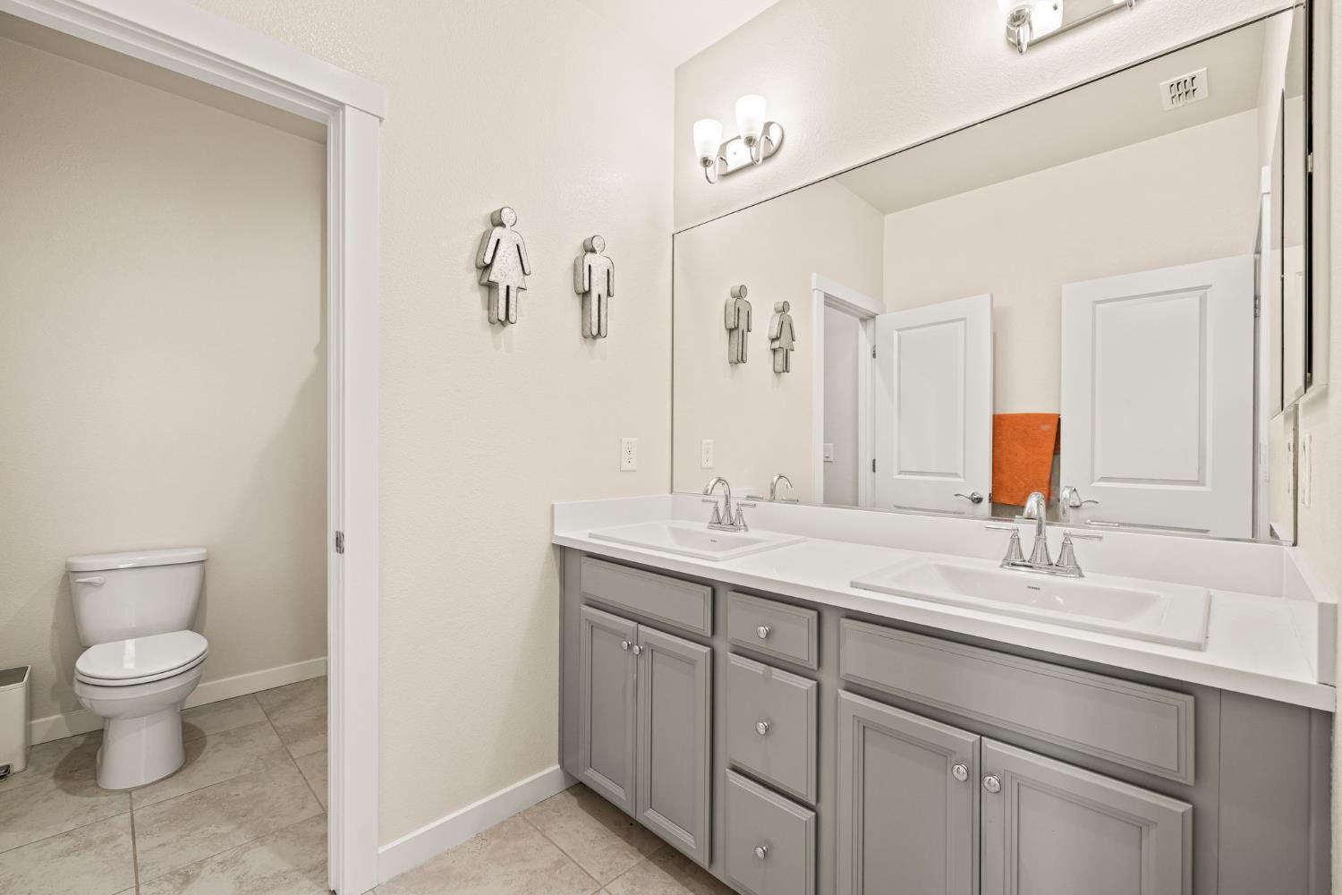 4040 Aura Way Rancho Cordova, CA 95742 - Photo 33 of 49 a bathroom with a toilet sink and mirror