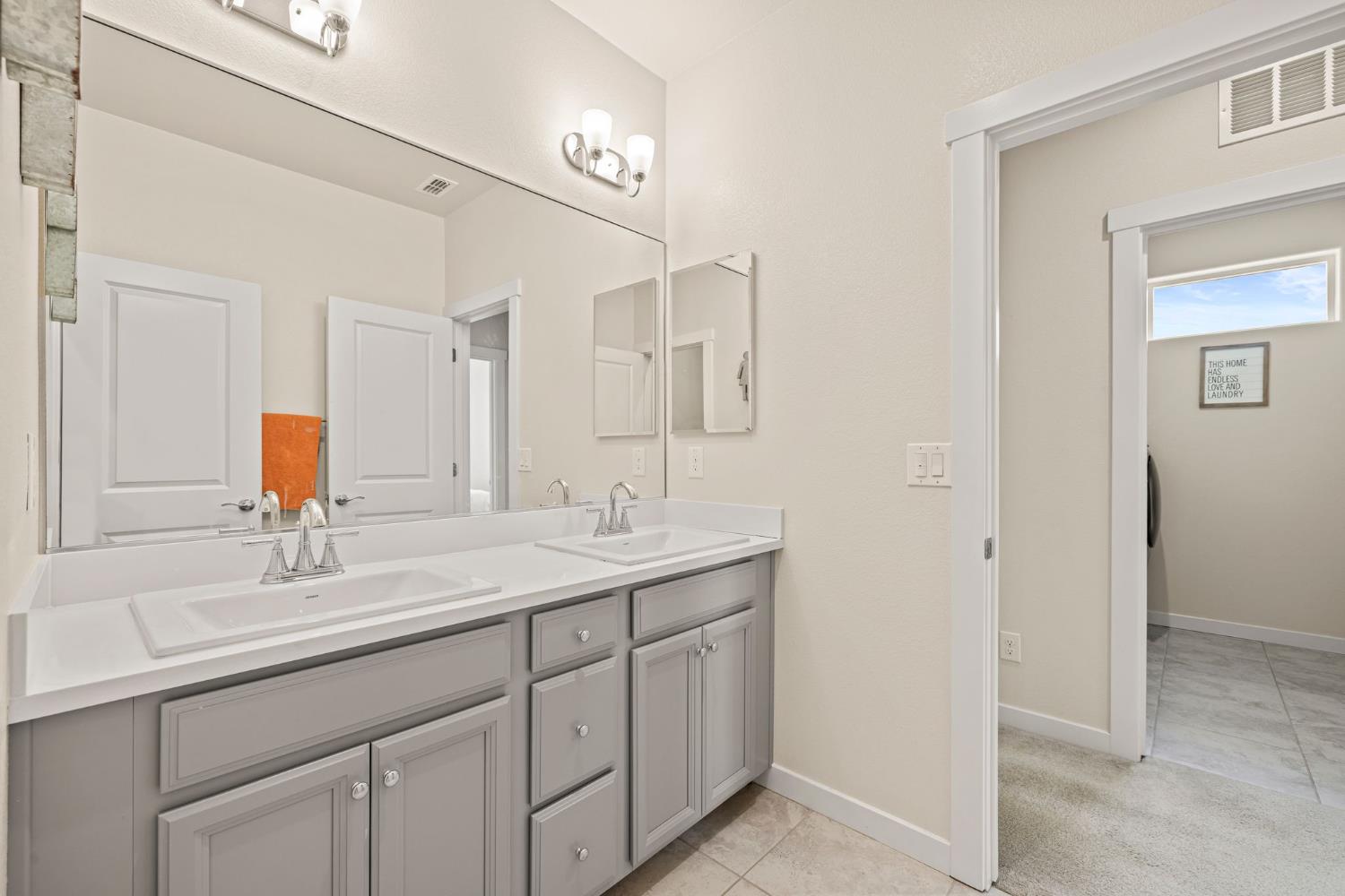 4040 Aura Way Rancho Cordova, CA 95742 - Photo 34 of 49 a bathroom with a sink and a mirror