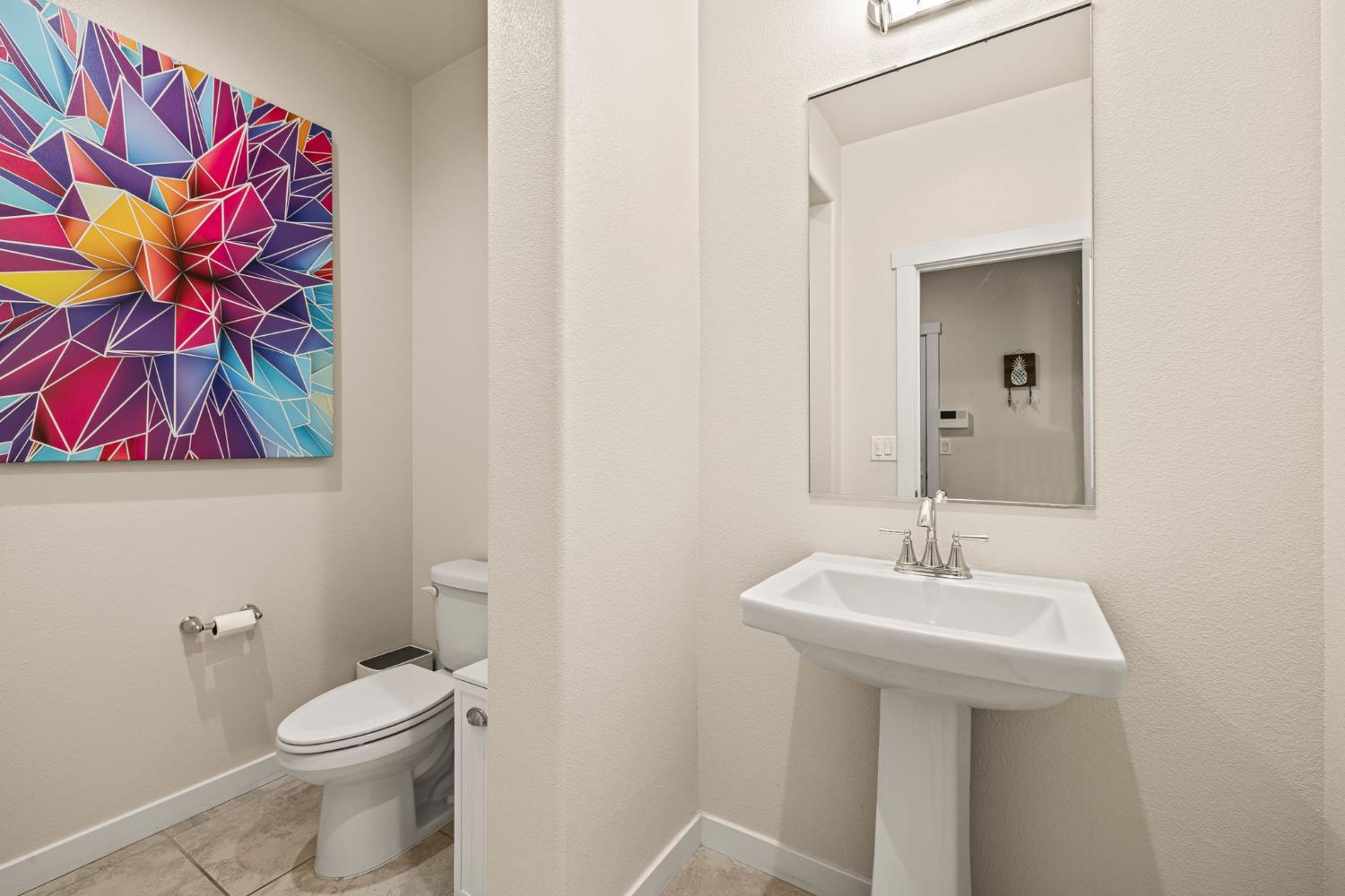 4040 Aura Way Rancho Cordova, CA 95742 - Photo 41 of 49 a bathroom with a toilet sink and mirror