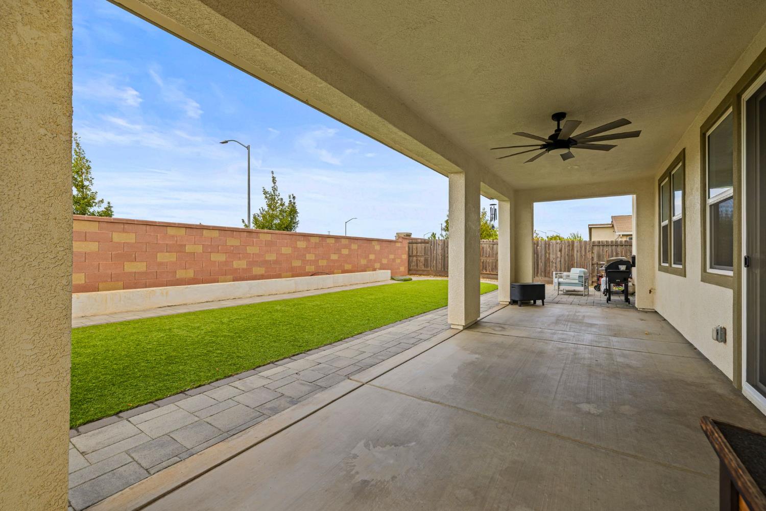 4040 Aura Way Rancho Cordova, CA 95742 - Photo 43 of 49 a view of a patio with a table and chairs under an umbrella