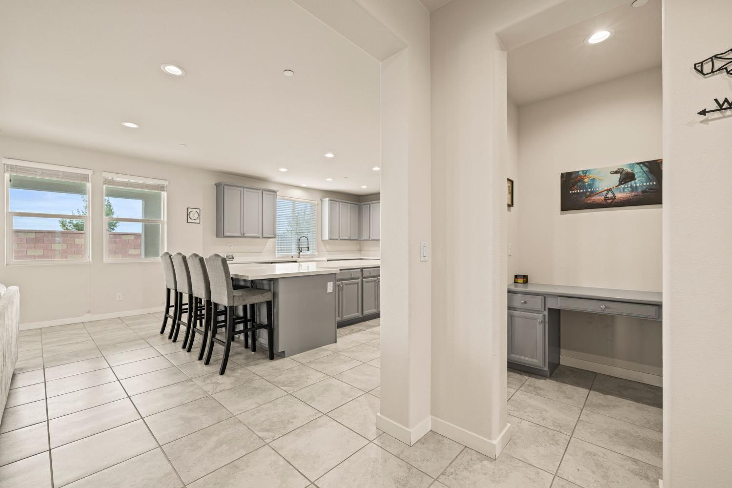 4040 Aura Way Rancho Cordova, CA 95742 - Photo 10 of 49 a kitchen with a sink and chairs