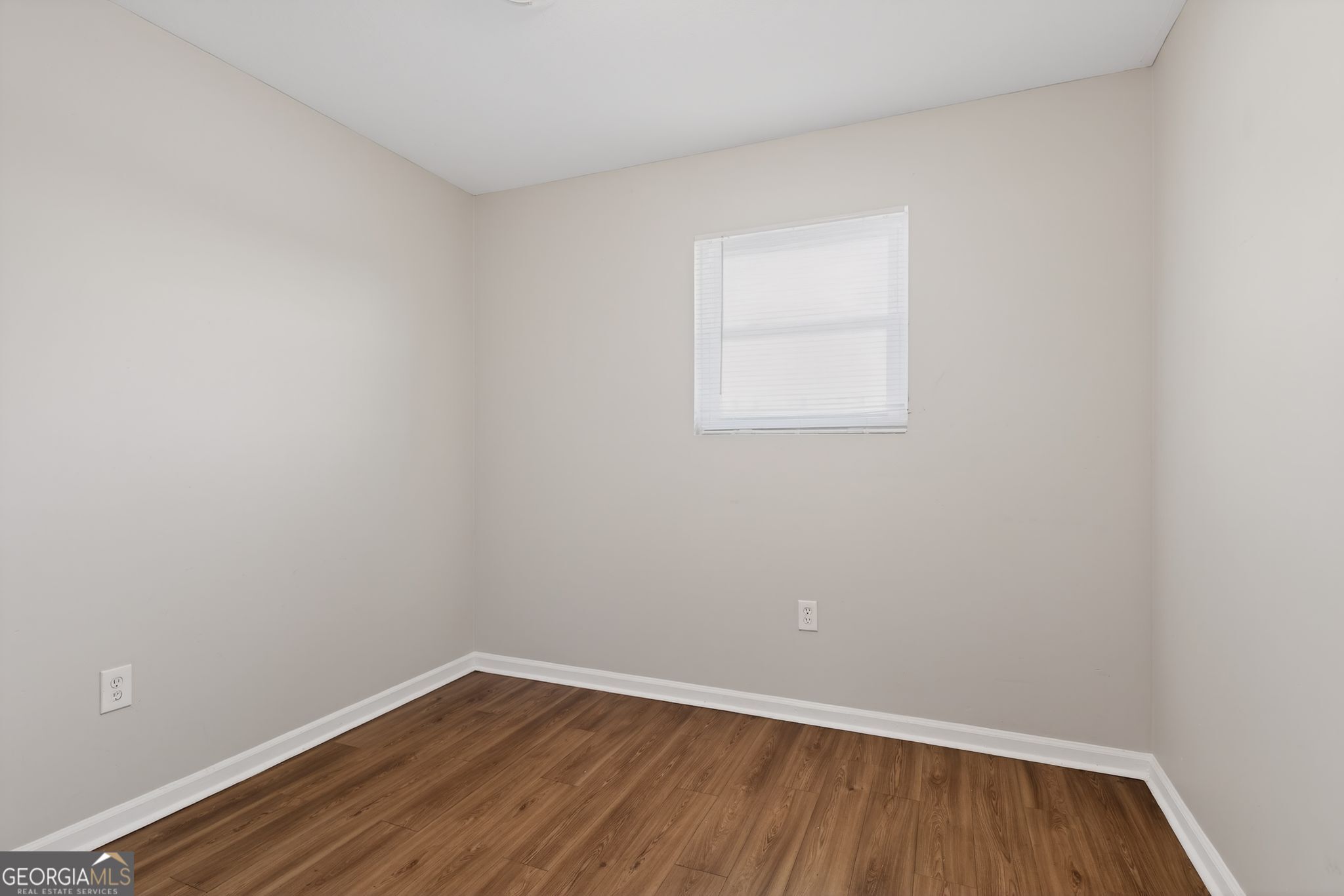 2508 Dexter Road Augusta, GA 30906 - Photo 13 of 33 a view of an empty room with wooden floor and a window
