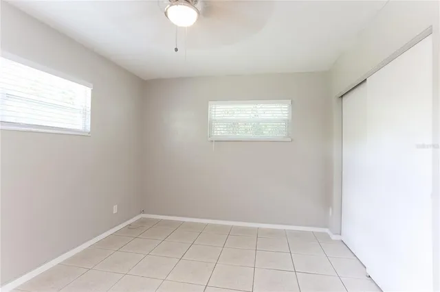 a view of an empty room and a window