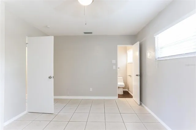 a bathroom with a sink mirror toilet and bathtub