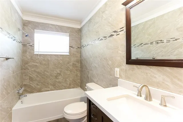 a view of an empty room with a bathroom