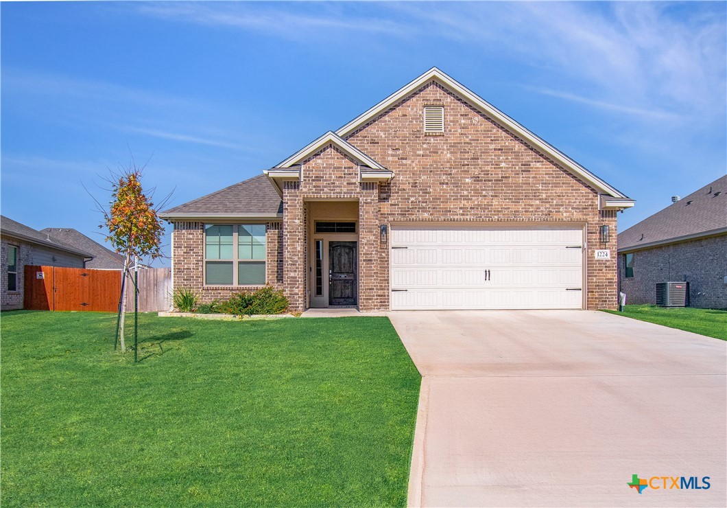 1224 Bending Branch Way Temple, TX 76502 - Photo 1 of 25 a view of backyard of house with green space