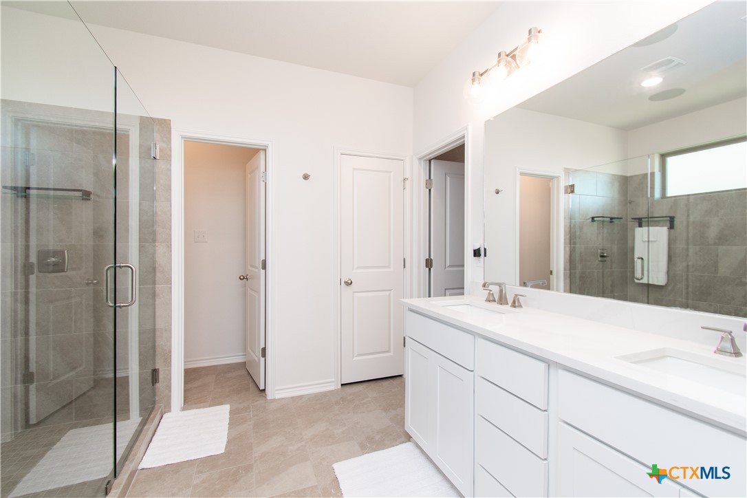 1224 Bending Branch Way Temple, TX 76502 - Photo 13 of 25 a bathroom with a sink and a mirror