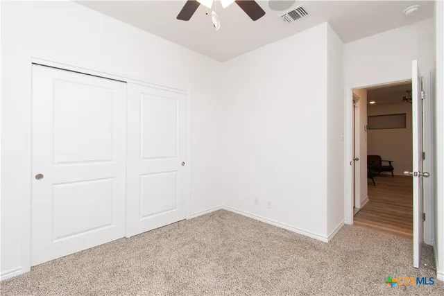 a view of a room that has a window in it