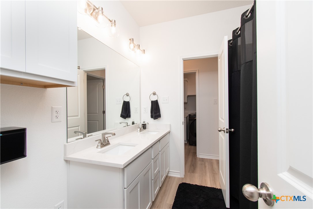 1224 Bending Branch Way Temple, TX 76502 - Photo 18 of 25 a bathroom with a sink a toilet and shower