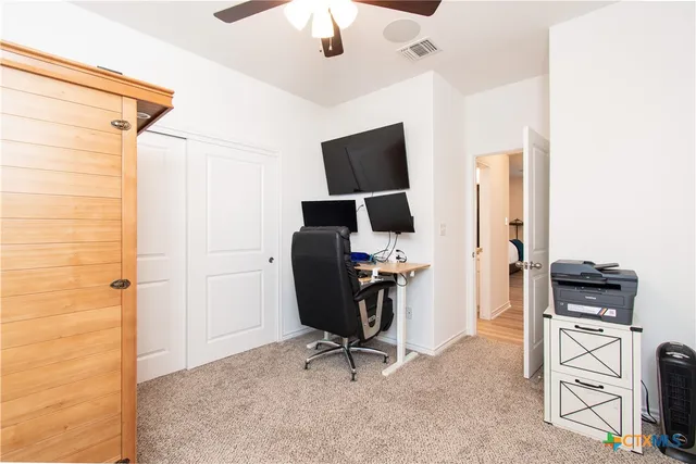 a view of a workspace with furniture