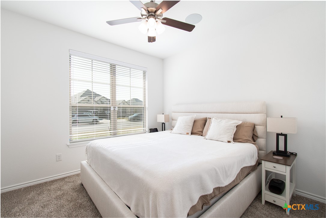1224 Bending Branch Way Temple, TX 76502 - Photo 21 of 25 a bedroom with a large bed and a window