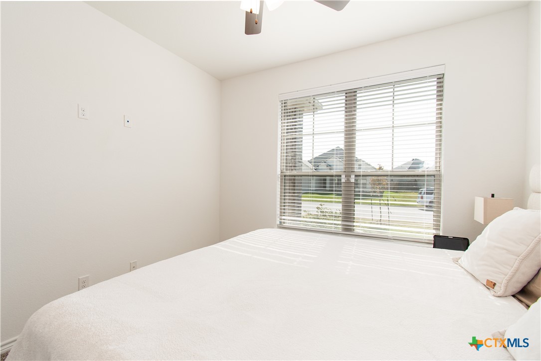 1224 Bending Branch Way Temple, TX 76502 - Photo 23 of 25 a view of a bedroom with a bed and a large window