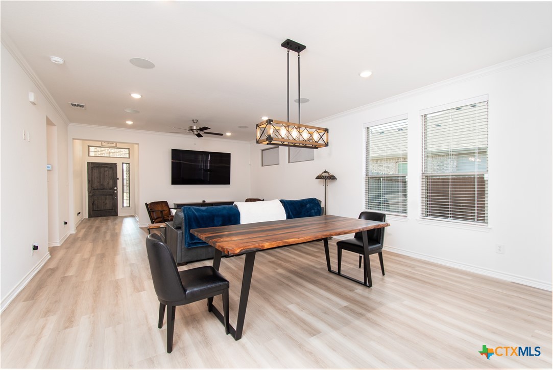 1224 Bending Branch Way Temple, TX 76502 - Photo 9 of 25 a view of a dining room with furniture window and wooden floor