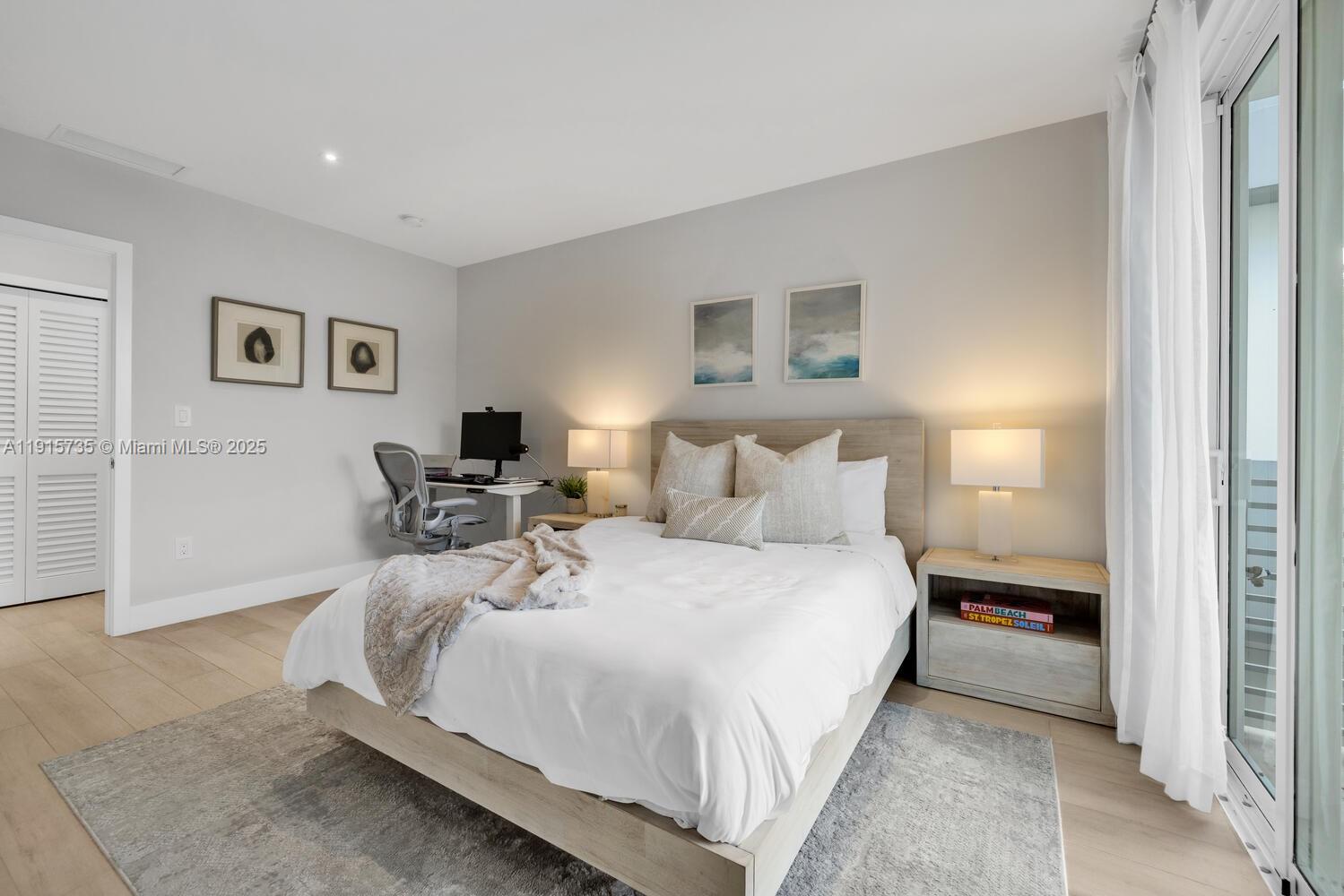 2851 Southwest 33rd Court, Unit 2851 Miami, FL 33133 - Photo 11 of 45 a bedroom with a bed and a night stand