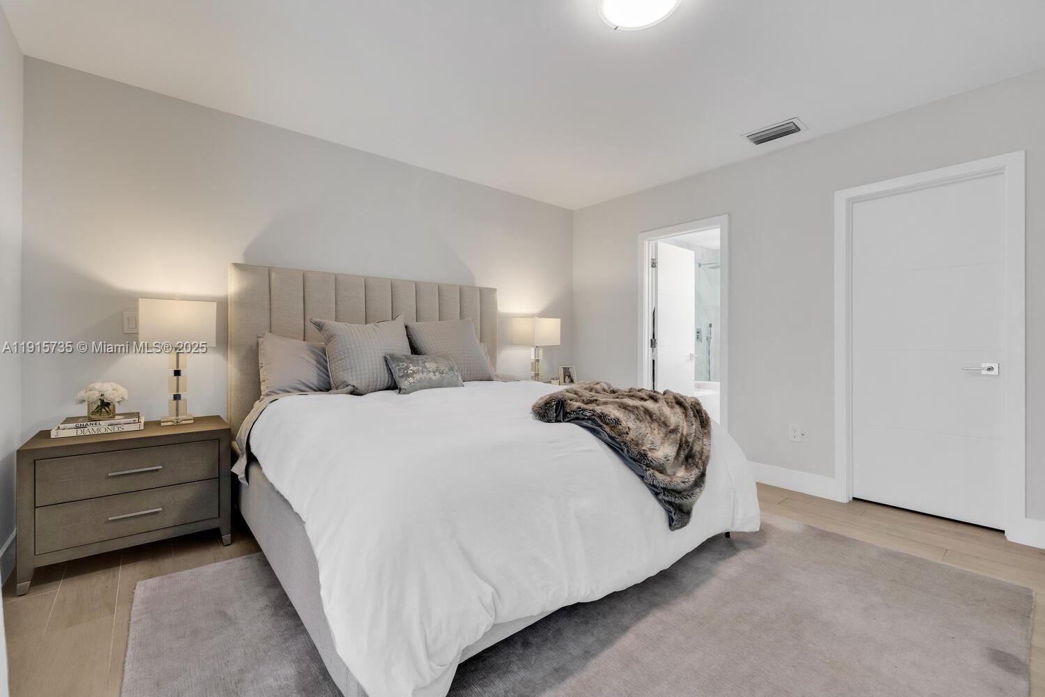 2851 Southwest 33rd Court, Unit 2851 Miami, FL 33133 - Photo 13 of 45 a bedroom with a bed and window