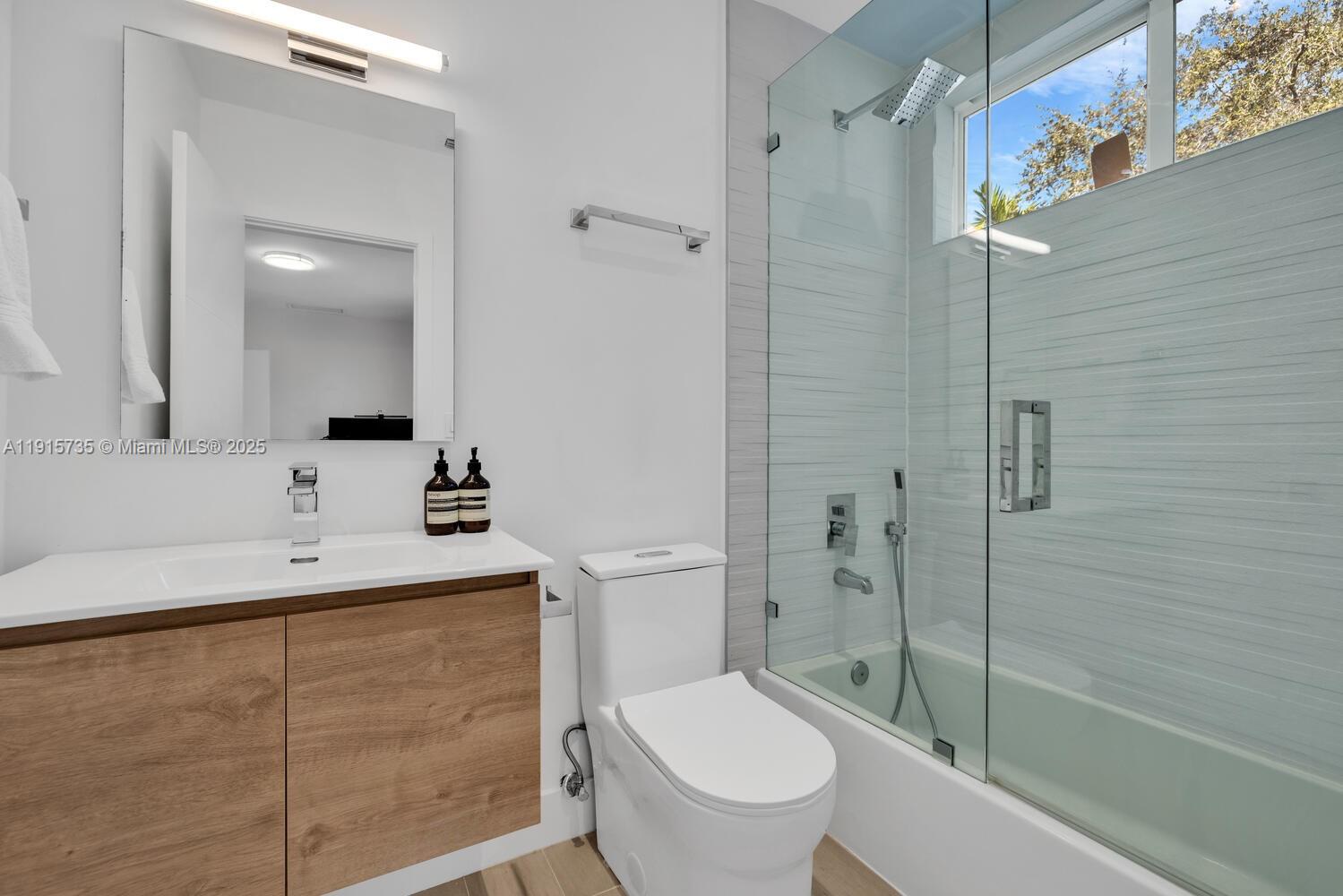 2851 Southwest 33rd Court, Unit 2851 Miami, FL 33133 - Photo 19 of 45 a bathroom with a sink a toilet and shower