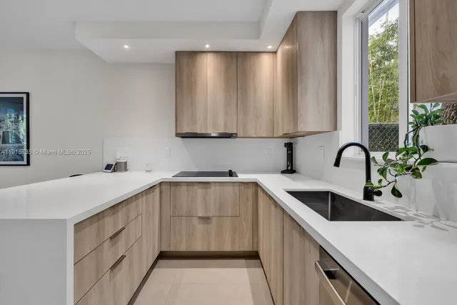 a kitchen with a sink and cabinets