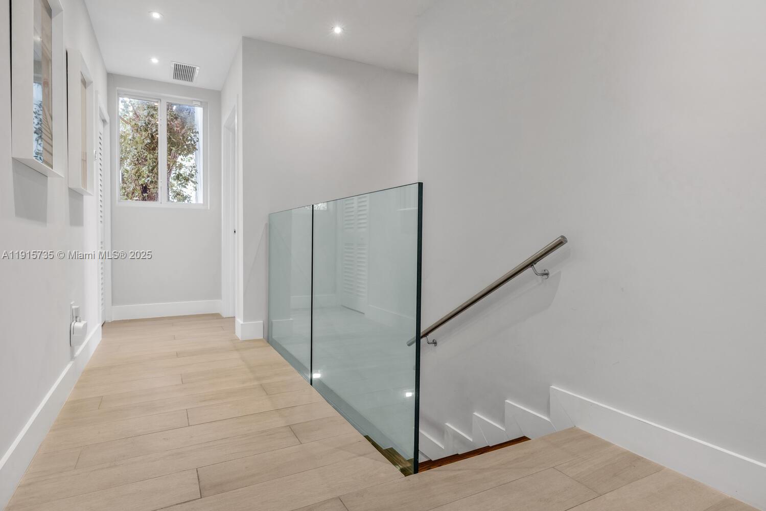 2851 Southwest 33rd Court, Unit 2851 Miami, FL 33133 - Photo 35 of 45 a view of an entryway with wooden floor