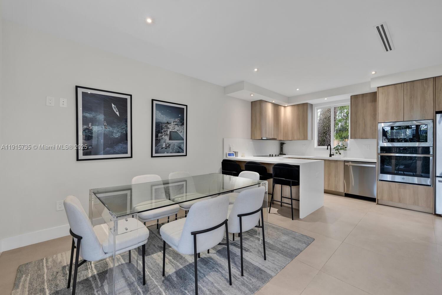 2851 Southwest 33rd Court, Unit 2851 Miami, FL 33133 - Photo 4 of 45 a view of kitchen with breakfast area