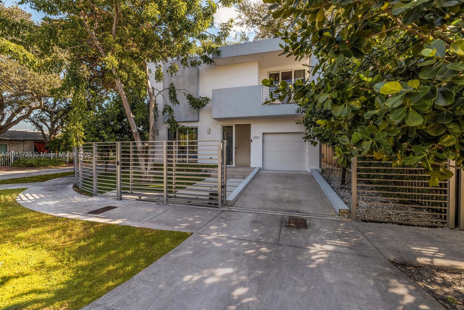 2851 Southwest 33rd Court, Unit 2851 Miami, FL 33133 - Photo 45 of 45 a view of a house with a yard