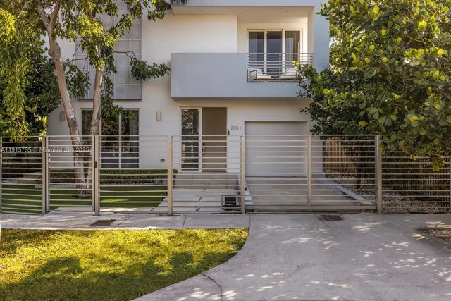 a view of house with backyard and a tub