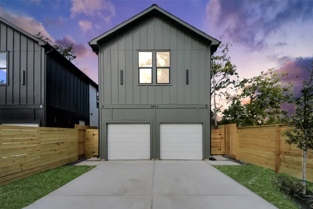 a front view of a house with garage