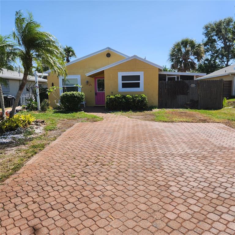 234 Patterson Avenue Osprey, FL 34229 - Photo 1 of 1 a front view of a house with a yard and a garage