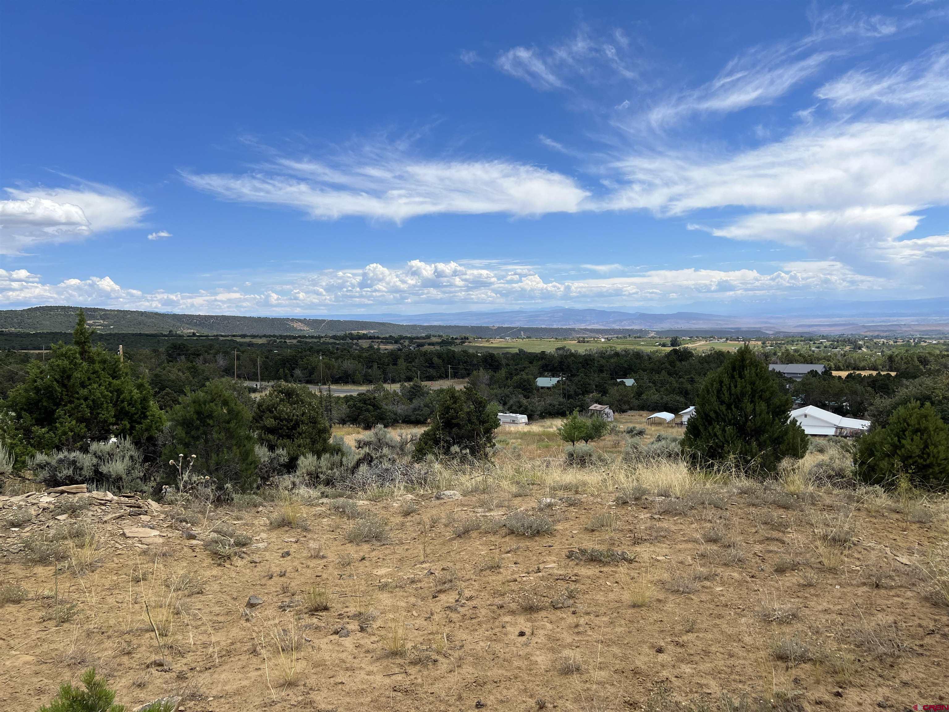 20567 Highway 65 Cedaredge, CO 81413 - Photo 3 of 8 a view of a lake with a mountain
