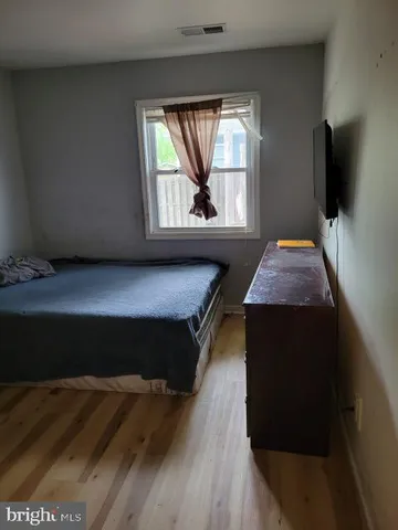 a living room with a fireplace and a flat screen tv