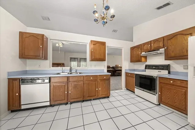 a spacious bathroom with a sink a mirror and a bathtub