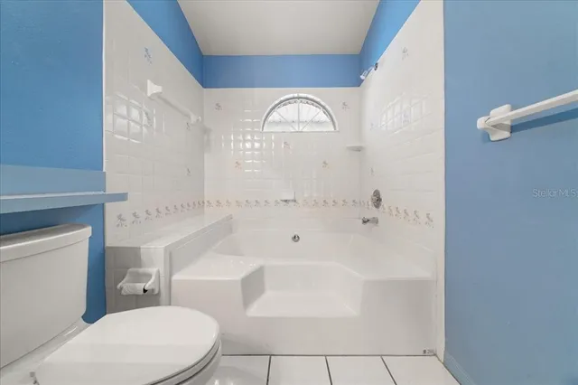a bathroom with a bathtub and a sink