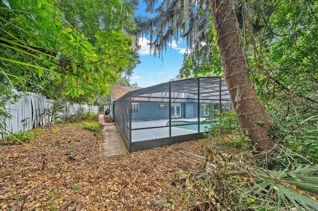 a house view with a wooden fence